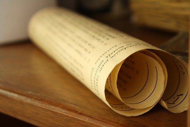 rolled up piece of printed parchment to illustrate a manuscript